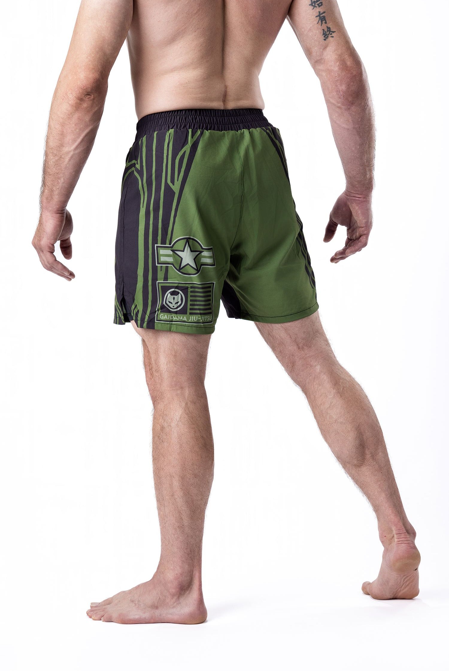 Green and black men's Jiu Jitsu board shorts with Air Force and military inspired details designed in collaboration with nogi BJJ rising star Jett Thompson, back view.